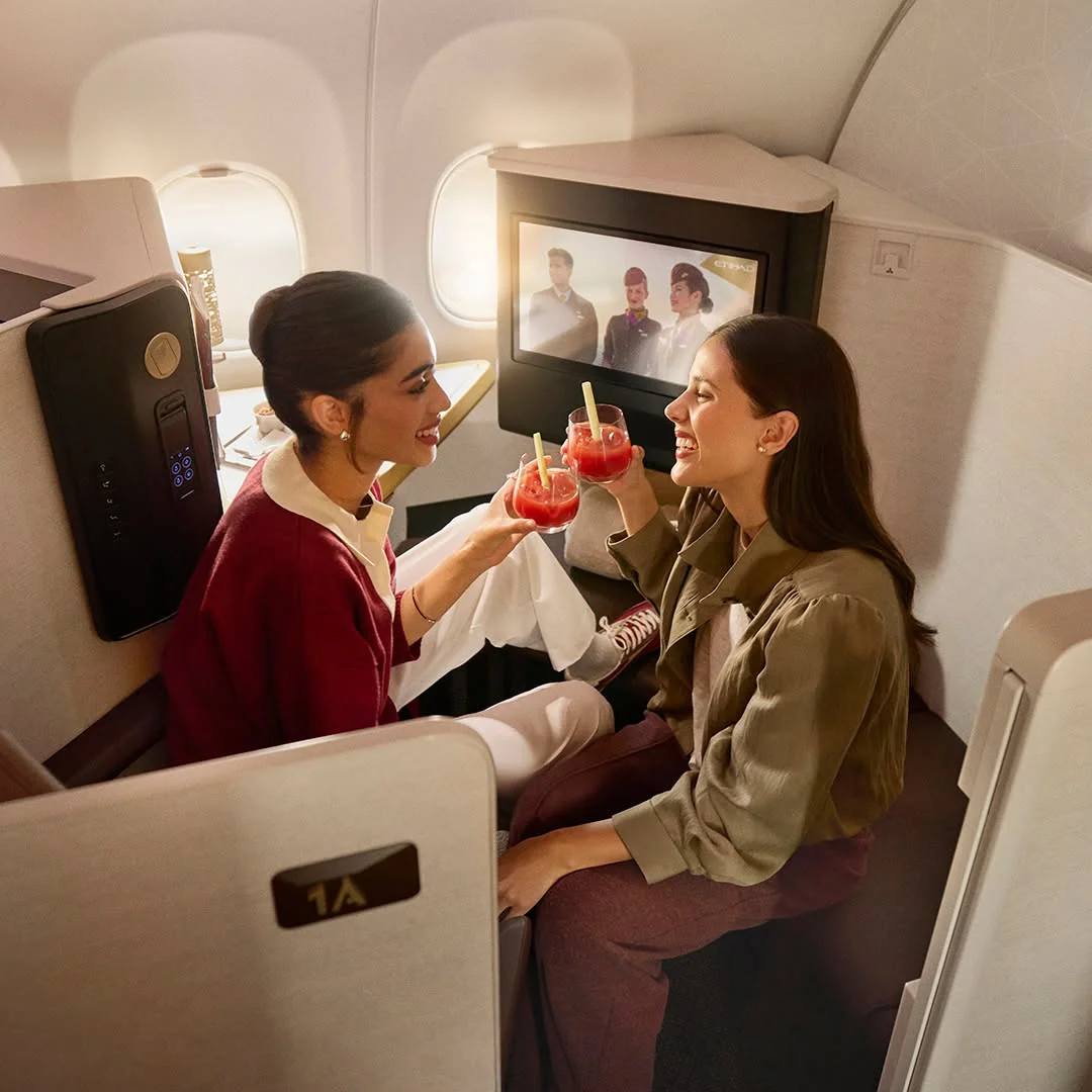Sophisticated editorial layout showcasing an Etihad Airways business class review inside the premium lounge