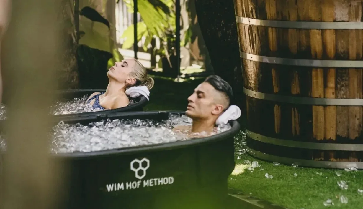 Sophisticated individuals practicing premium healthy lifestyles using advanced red light and oxygen chambers