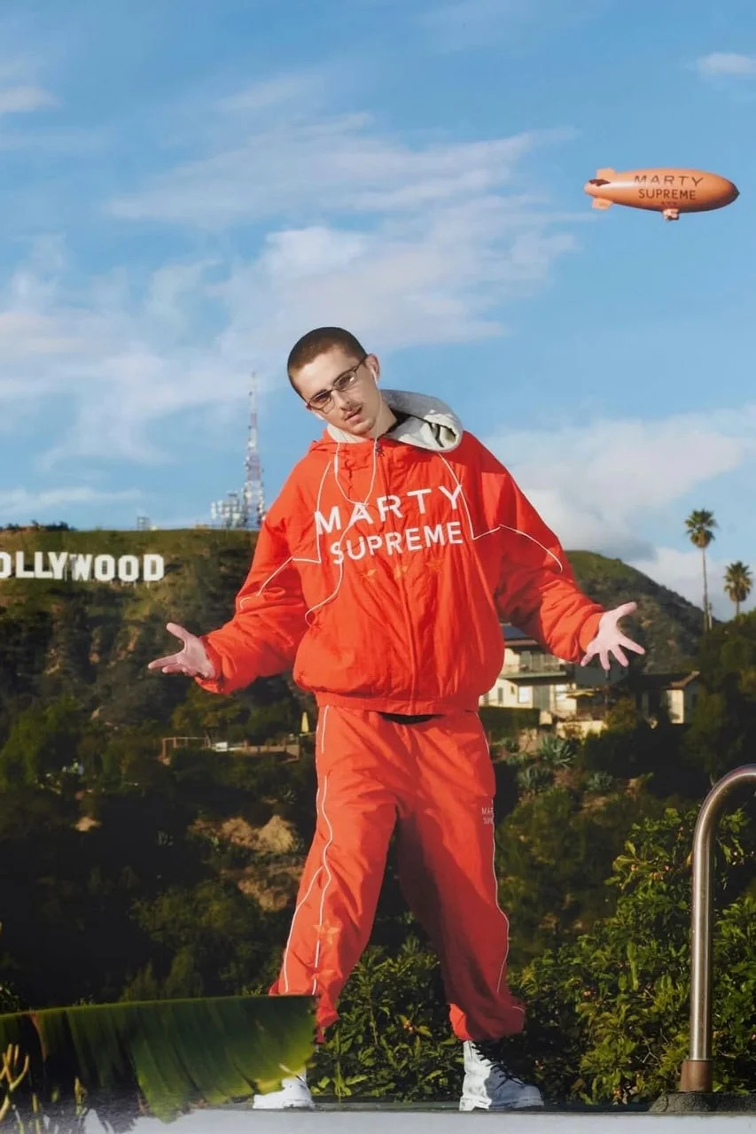 Marty Supreme tracksuit in Cloud Dancer and Flame orange