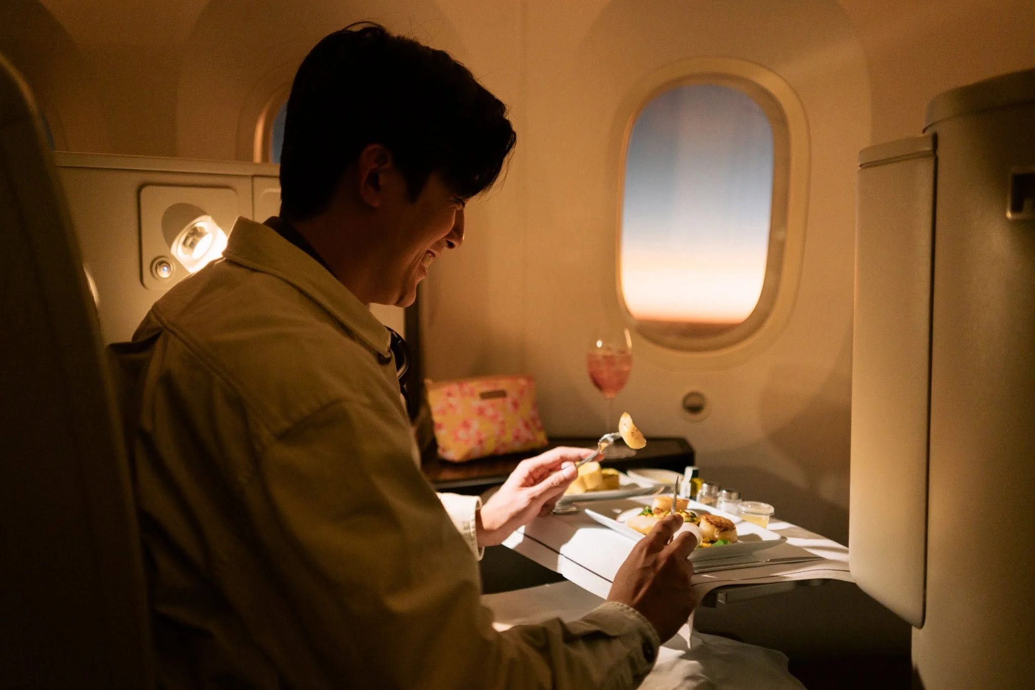 Premium in-flight dining service and luxury amenities aboard Thai Airways business class flights