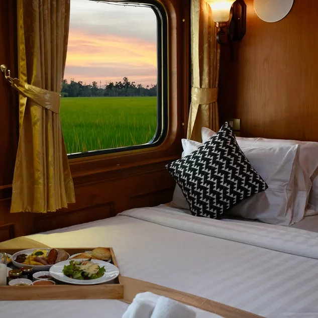 The Blue Jasmine luxury train traversing a scenic route in Thailand